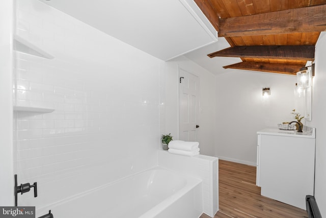 bathroom with hardwood / wood-style flooring, lofted ceiling with beams, and wooden ceiling