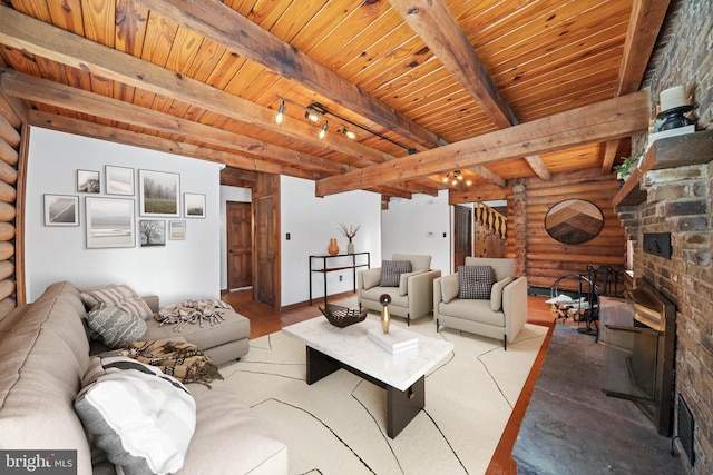 living room with beamed ceiling, log walls, and wooden ceiling