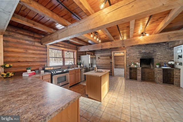 kitchen with beam ceiling, wooden ceiling, rustic walls, and appliances with stainless steel finishes