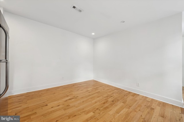 empty room with light wood-type flooring