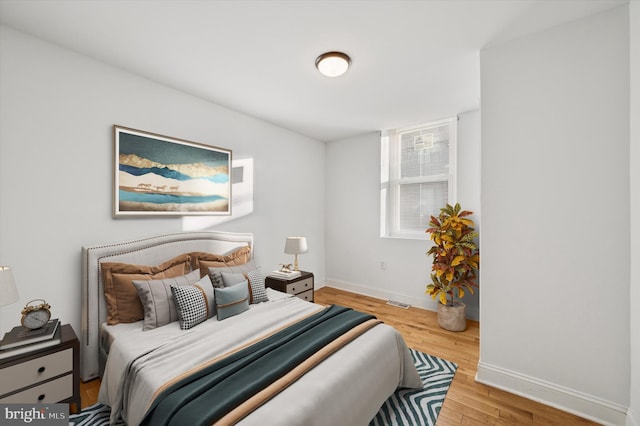 bedroom with light hardwood / wood-style flooring