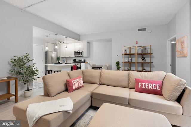 living room featuring light wood-type flooring