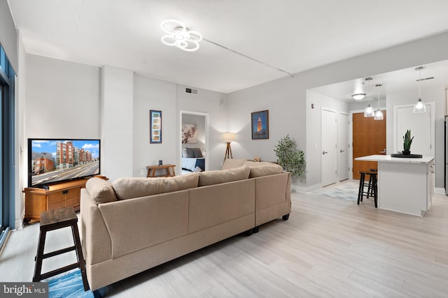 living room with light hardwood / wood-style flooring