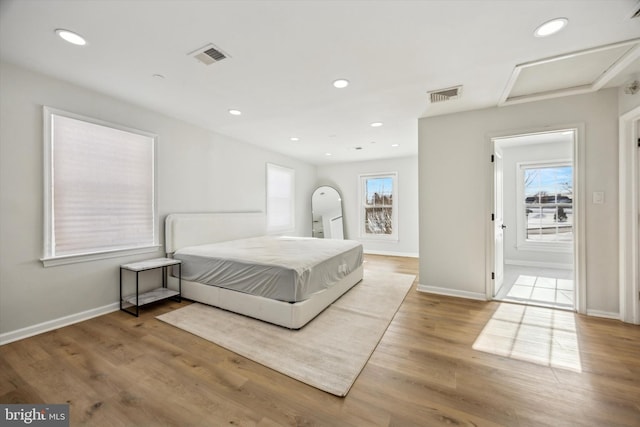 bedroom with light hardwood / wood-style flooring