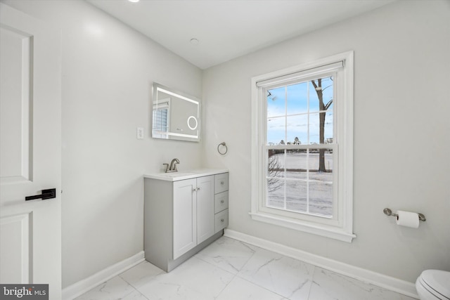 bathroom with vanity and toilet