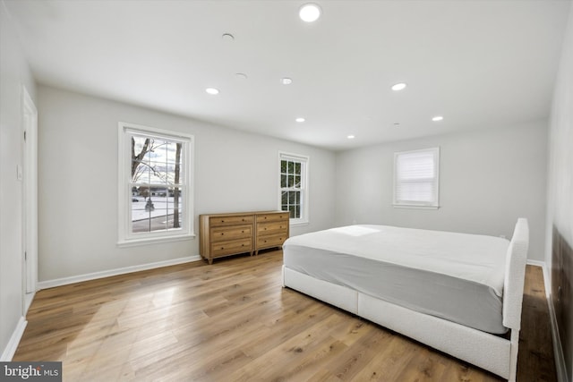 bedroom with light hardwood / wood-style floors