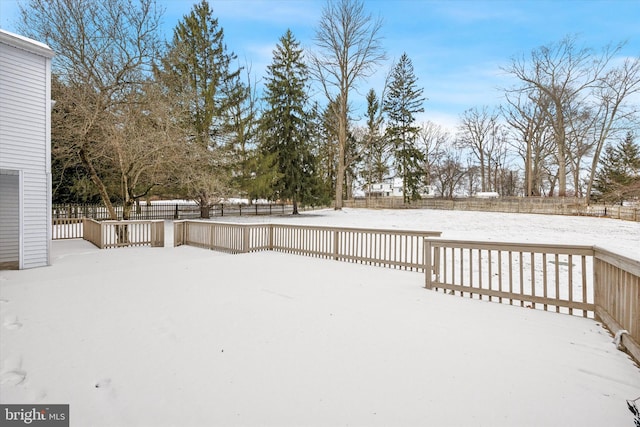 view of yard layered in snow