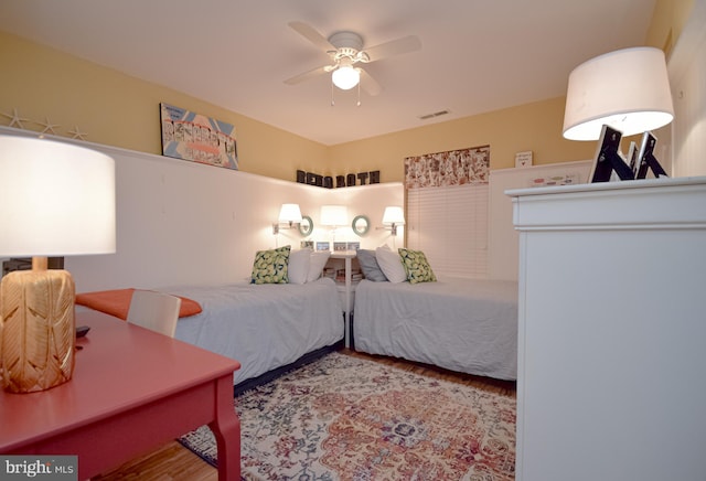 bedroom with ceiling fan and light wood-type flooring