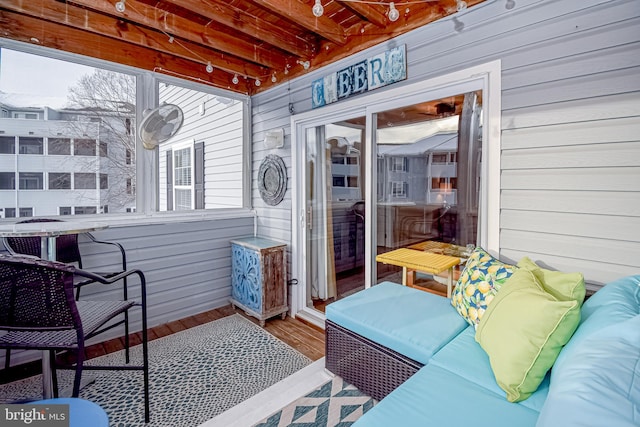 sunroom / solarium featuring plenty of natural light