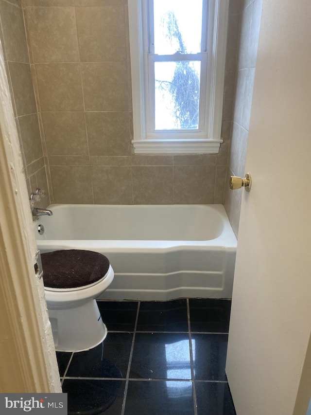 bathroom with tile patterned floors and toilet