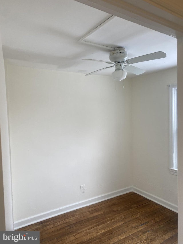 unfurnished room featuring ceiling fan and dark hardwood / wood-style flooring