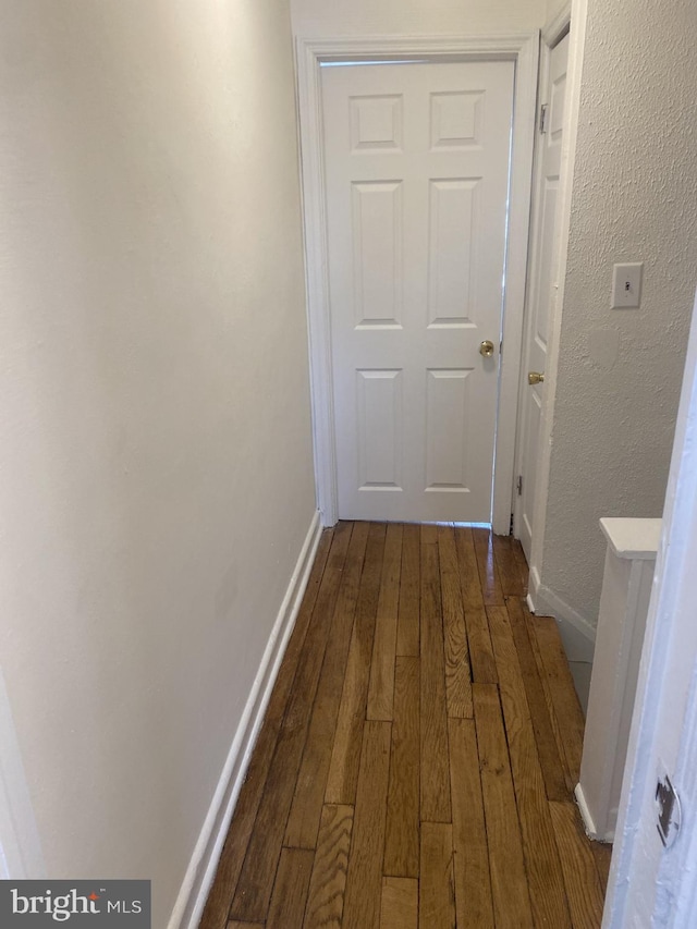 hallway featuring hardwood / wood-style floors