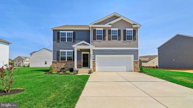 craftsman-style house featuring a front yard and a garage