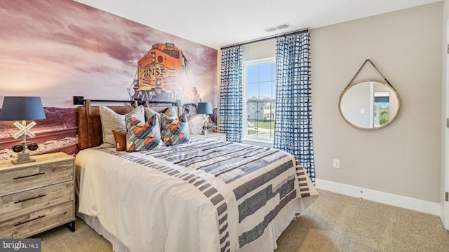 bedroom with light colored carpet