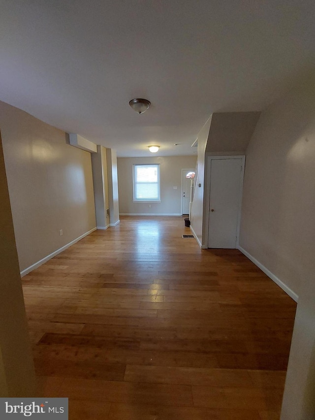 hallway with light wood-type flooring