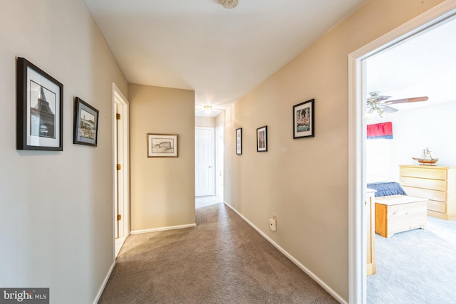 corridor featuring light carpet