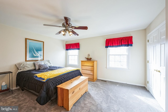 carpeted bedroom with ceiling fan