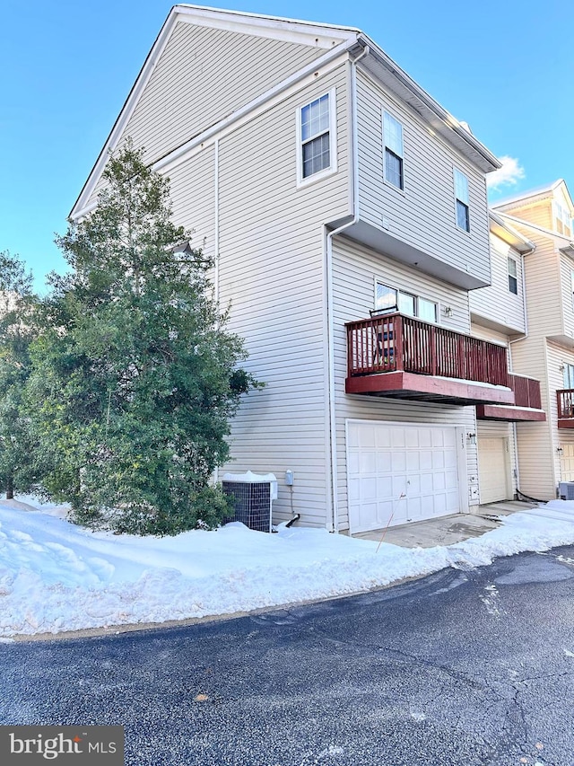 exterior space with central AC unit and a balcony