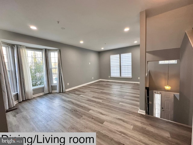 unfurnished living room with hardwood / wood-style floors