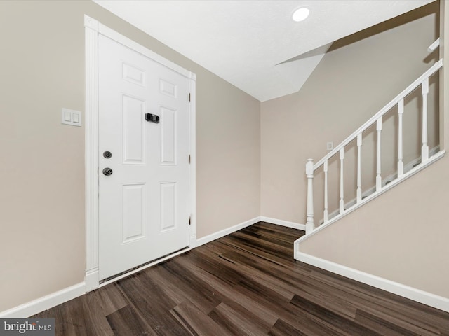 foyer entrance with dark wood-type flooring