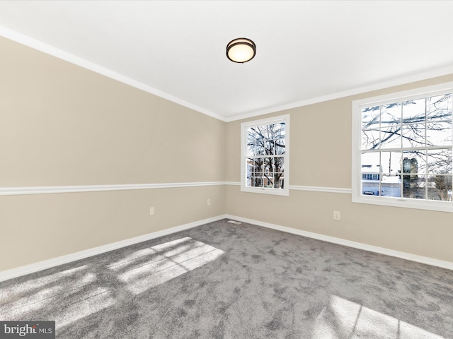 carpeted empty room with ornamental molding