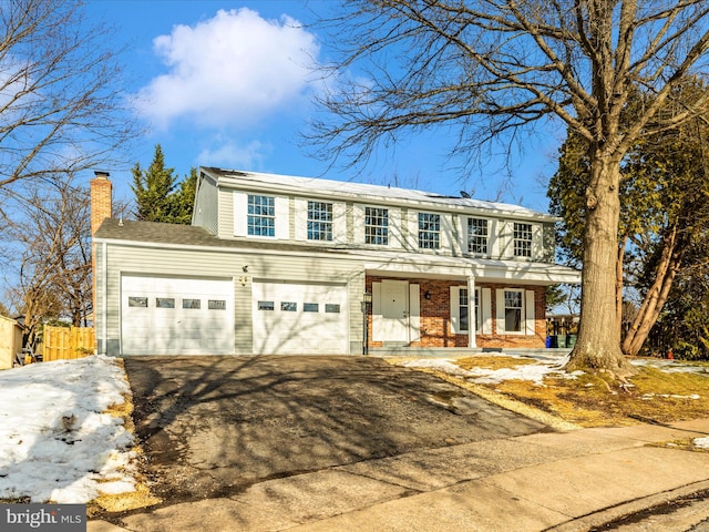 view of front facade with a garage and covered porch