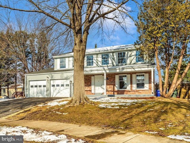 view of front of home with a garage and covered porch