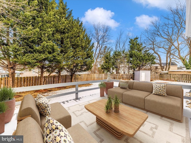 view of patio / terrace featuring a shed and an outdoor hangout area