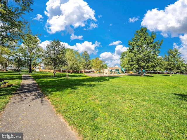 view of community with a playground and a lawn