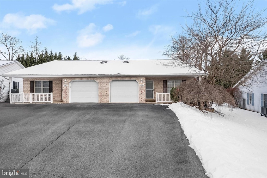 ranch-style house featuring a garage