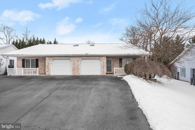 ranch-style house featuring a garage