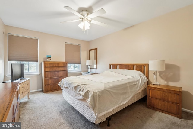 bedroom with ceiling fan and light colored carpet