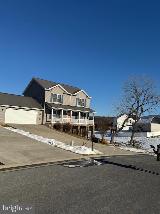 view of front of home with a garage and a porch