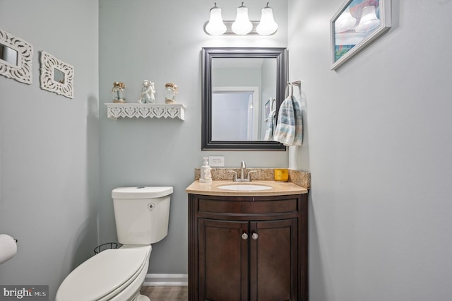 bathroom with toilet and vanity