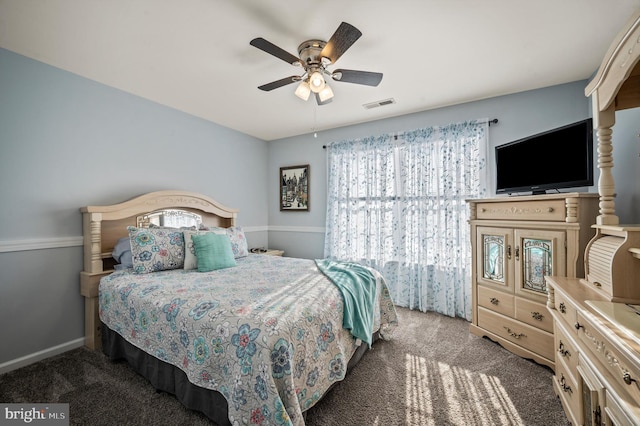 bedroom featuring ceiling fan and dark colored carpet