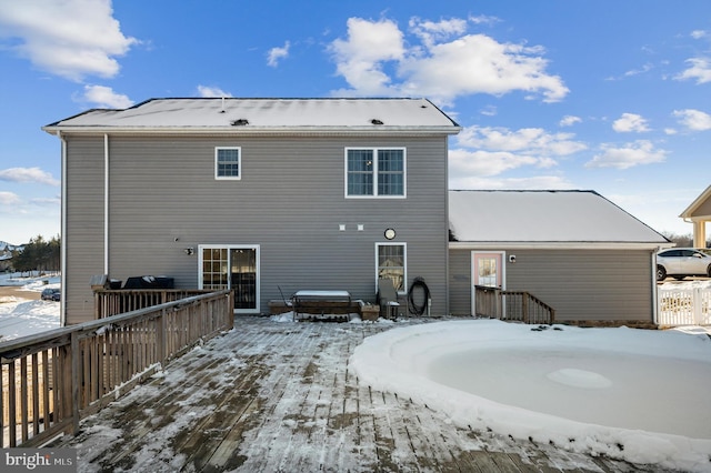 view of snow covered house