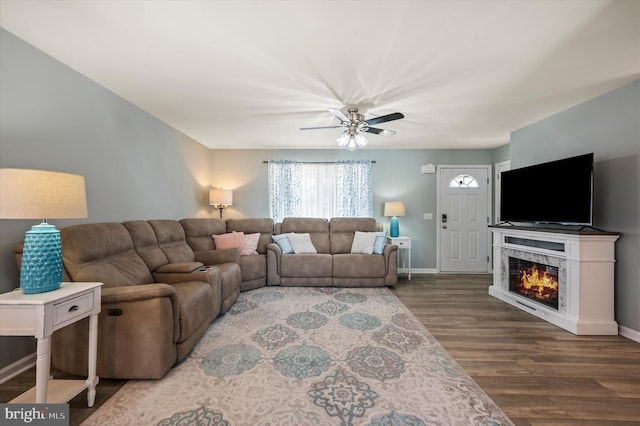 living room with ceiling fan and hardwood / wood-style floors