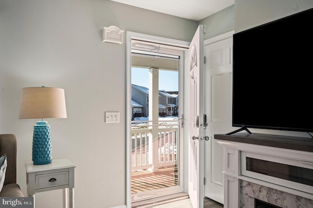 doorway to outside with light wood-type flooring