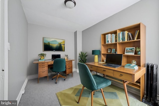 home office featuring carpet floors and baseboards