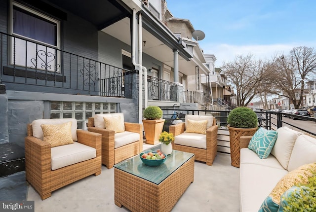 view of patio / terrace with a residential view and outdoor lounge area