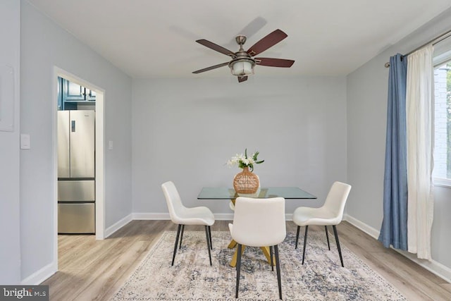 dining space with light hardwood / wood-style floors