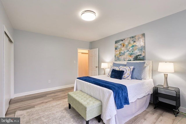 bedroom with light hardwood / wood-style floors