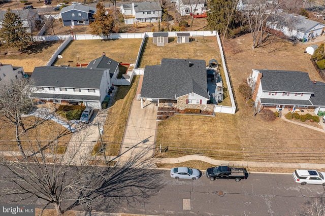 birds eye view of property with a residential view