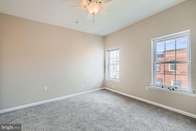 carpeted empty room with ceiling fan