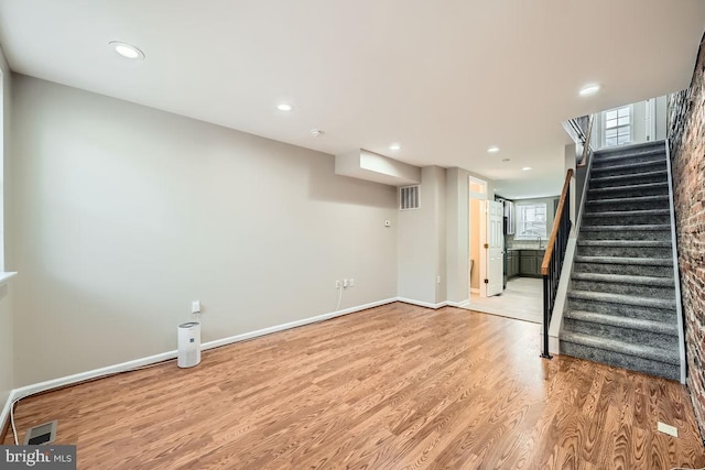 basement with light wood-type flooring