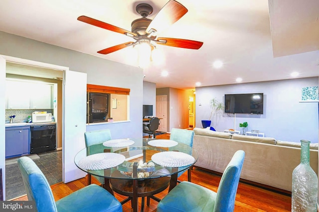 dining space featuring ceiling fan and dark hardwood / wood-style floors