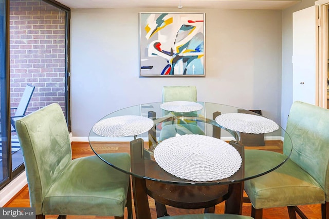 dining room with wood-type flooring