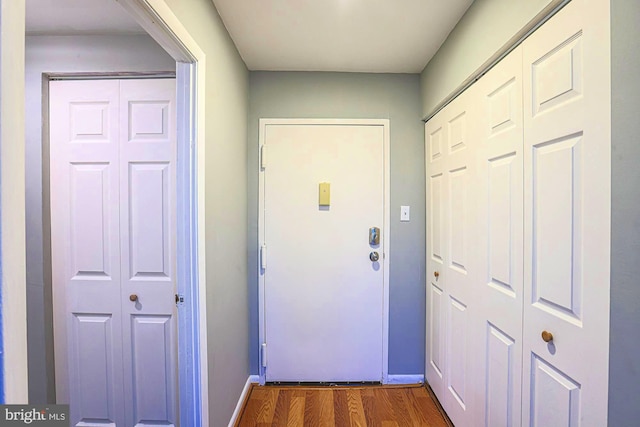 doorway featuring dark hardwood / wood-style floors