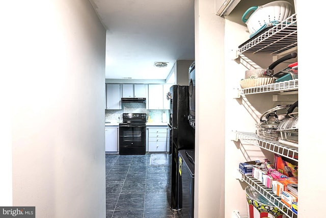 hallway featuring washer / clothes dryer