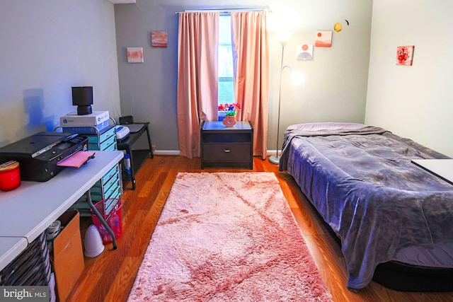 bedroom featuring wood-type flooring